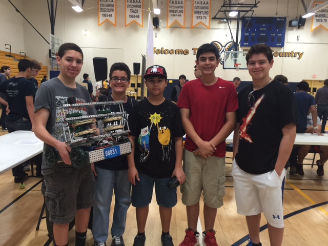 students participating in robotics competition
